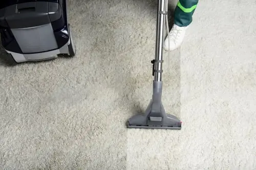 Flores Pro-Cleaning vacuuming a living-room carpet in Austin